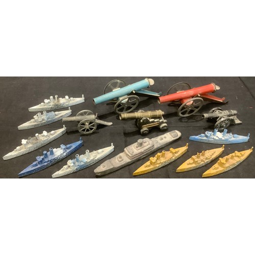 310 - A collection of ten battleships, two tinplate cannons, three other cannons