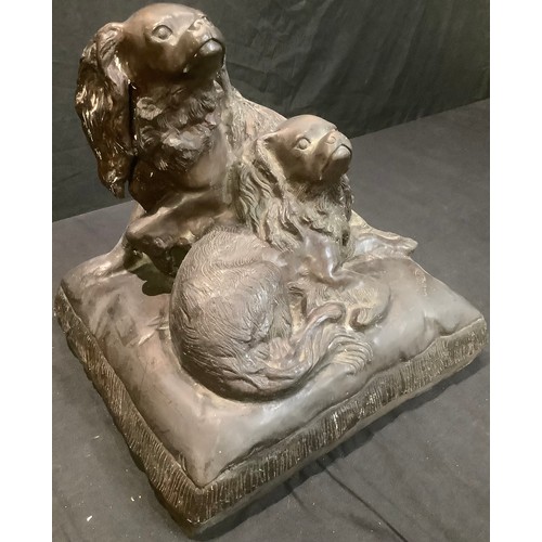 265 - After Charles Valton, a brown-patinated animalier bronze, of King Charles Spaniels, seated upon a cu... 