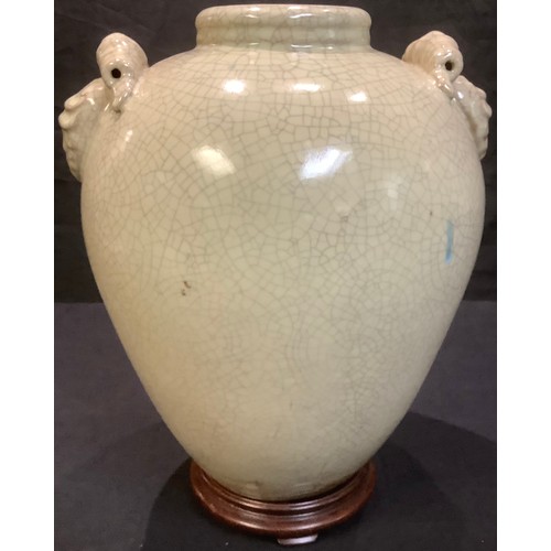 346 - A large Chinese crackle glaze vase, lion mask handles, hardwood stand, 43cm high overall