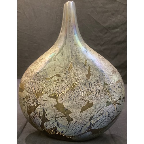 388 - An isle of Wight flattened ovoid bottle vase, in iridescent shades of brown and purple, picked out i... 