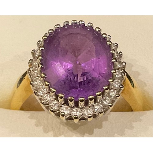 432 - An 18ct gold amethyst and diamond ring, size P/Q, 6.5g