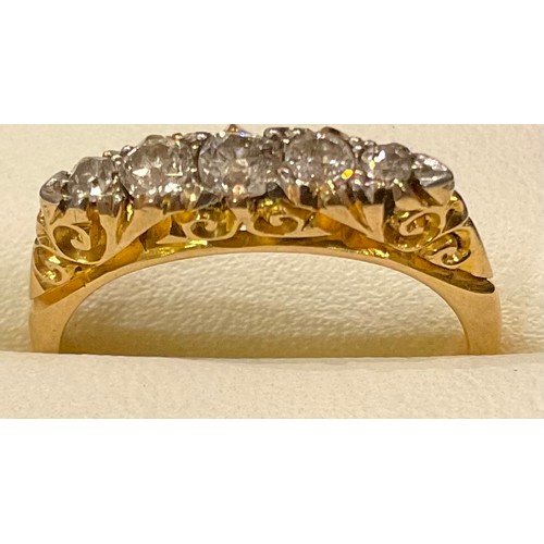 434 - An 18ct gold five stone graduated diamond ring, size L, 3.2g; a 9ct gold eternity ring, unmarked, si... 