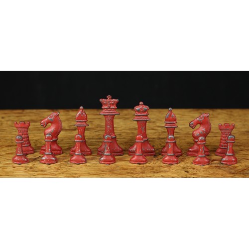 466 - An early 20th century painted lead chess set, most pieces stamped ‘MADE IN ENGLAND’ to the bases, th... 