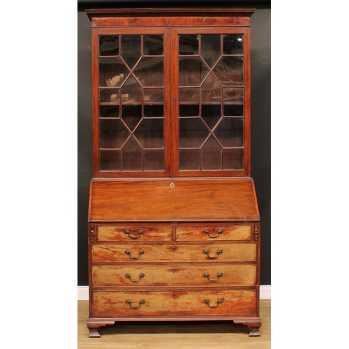 101 - A George III mahogany bureau bookcase, moulded cornice above a pair of doors enclosing a shelf, fall... 