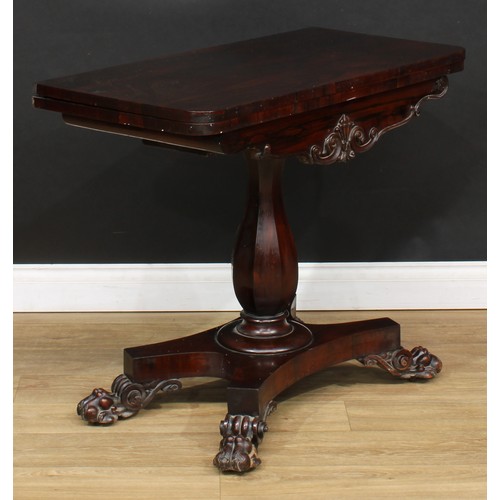 106 - A William IV rosewood card table, fault to hinges, panelled baluster column, incurve base, paw feet,... 