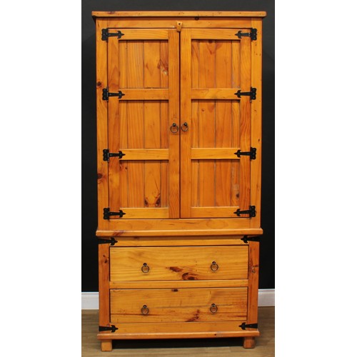 120 - A pine three-piece bedroom suite, comprising wardrobe, 190cm high, 94cm wide, 62cm deep, hanging pre... 