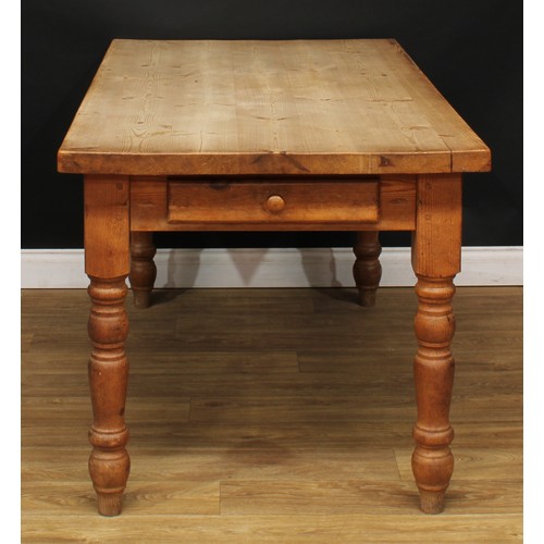 201 - A farmhouse pine dining table, rectangular top, drawer to frieze, turned legs, 77.5cm high, 160cm lo... 