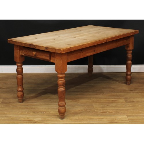 201 - A farmhouse pine dining table, rectangular top, drawer to frieze, turned legs, 77.5cm high, 160cm lo... 