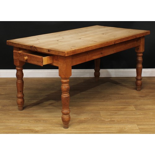 201 - A farmhouse pine dining table, rectangular top, drawer to frieze, turned legs, 77.5cm high, 160cm lo... 