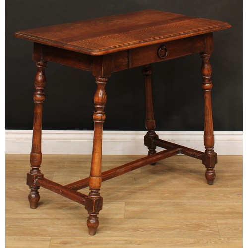 211 - A Spanish Baroque style oak side table, rounded rectangular top with moulded edge above a single fri... 