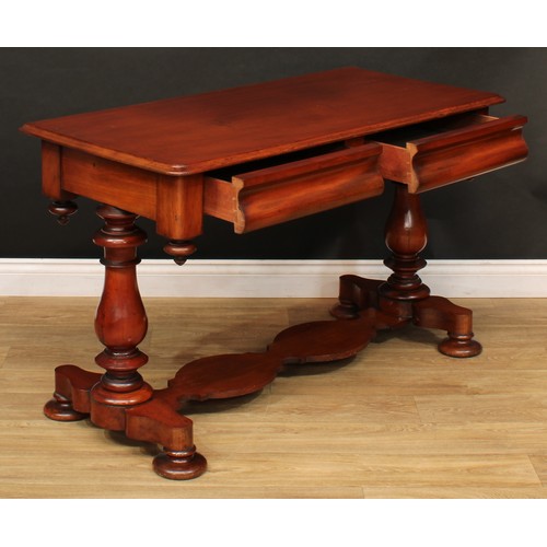 217 - An early Victorian mahogany side table, moulded top above a pair of concave frieze drawers, turned b... 