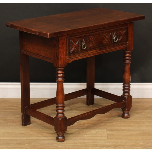 525 - A 17th century style oak side table, oversailing top above a carved frieze drawer, turned supports, ... 