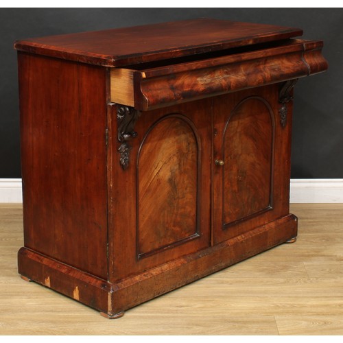 528 - A Victorian mahogany side cabinet or low chiffonier, rectangular top above a long concave moulded fr... 