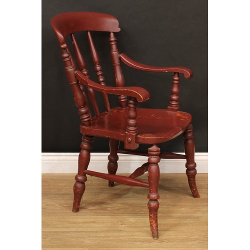 534 - A 19th century painted open armchair, curved cresting rail, turned spindles, shaped arms terminating... 