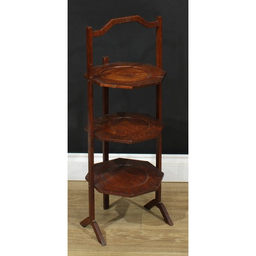 535 - A George III style mahogany pedestal wine table; an early 20th century three-tier cake stand; a Suth... 