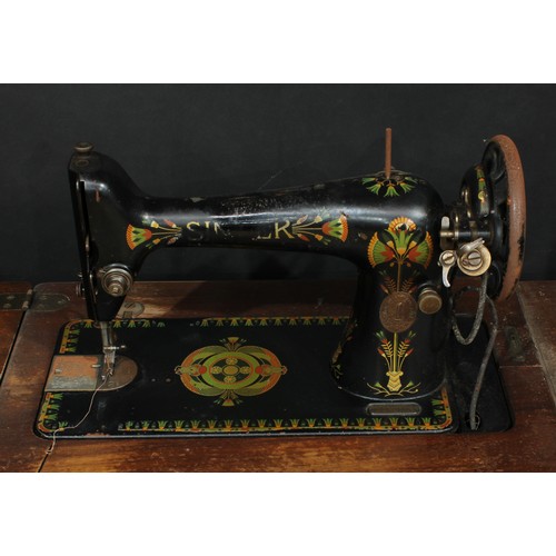 542 - An early 20th century Egyptian Revival Singer sewing machine, 'The Memphis Sphinx', treadle base; an... 