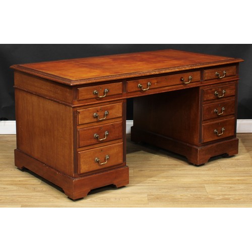 17 - An early 20th century mahogany twin pedestal desk, rectangular top with inset tooled and gilt writin... 