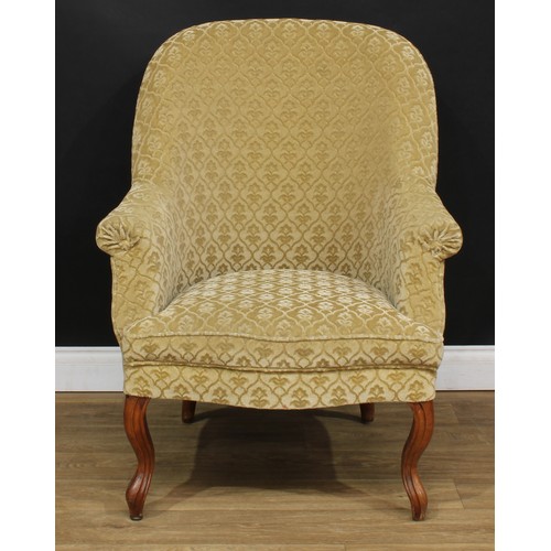 6 - An early 20th century French walnut crapaud armchair, 101cm high, 79cm wide, the seat 49cm wide and ... 