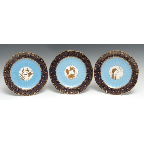 380 - A set of three Mintons Aesthetic Movement  cabinet plates, the centres in raised gilt with Kingfishe... 