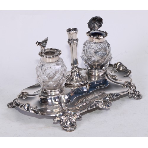 28 - A Victorian Sheffield silver-plated Rococo Revival shaped rectangular partner's standish, centred by... 