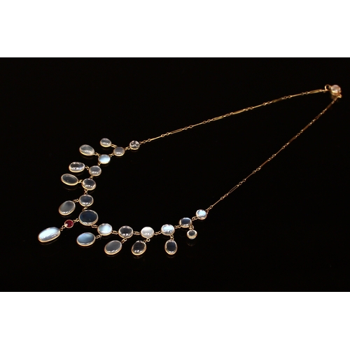 339 - An Edwardian moonstone and gold coloured metal Etruscan style necklace, the ten graduated circular c... 