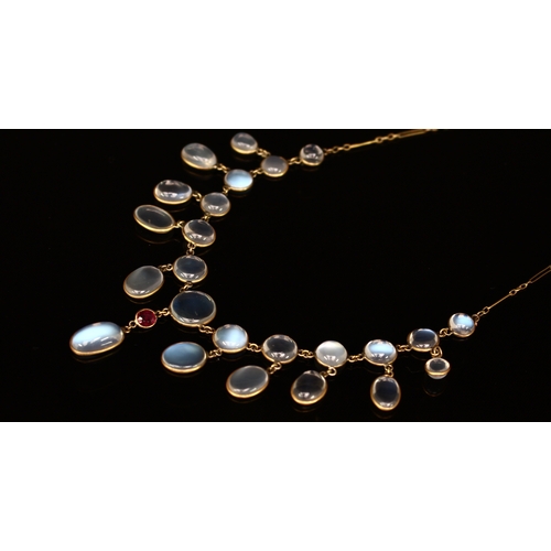 339 - An Edwardian moonstone and gold coloured metal Etruscan style necklace, the ten graduated circular c... 