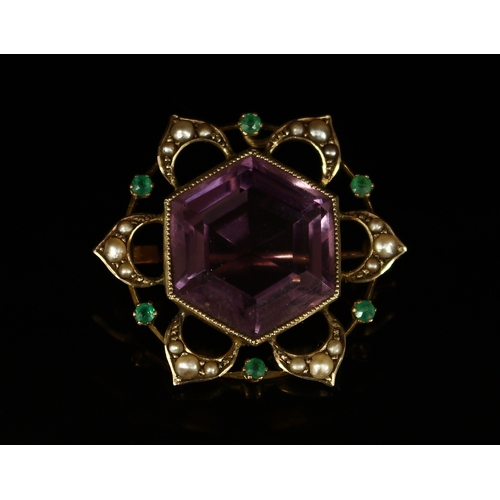 341 - An unusual amethyst, seed pearl and emerald flowerhead brooch, the large hexagonal faceted amethyst ... 