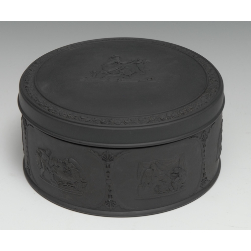 370 - A 19th century Wedgwood black basalt circular table box and cover, sprigged in the Neo-Classical tas... 