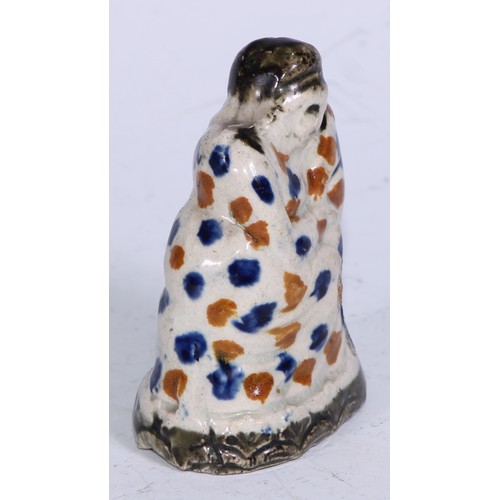 379 - A Prattware  figure, modelled as a lady wrapped in a shawl, sponged in tones of blue and brown, 7.5c... 