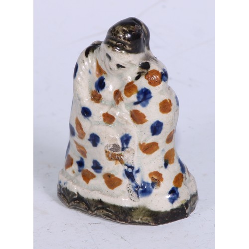 379 - A Prattware  figure, modelled as a lady wrapped in a shawl, sponged in tones of blue and brown, 7.5c... 