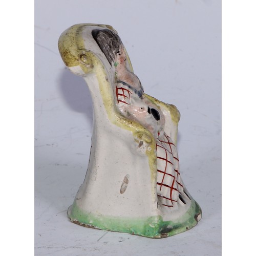 379 - A Prattware  figure, modelled as a lady wrapped in a shawl, sponged in tones of blue and brown, 7.5c... 