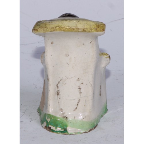 379 - A Prattware  figure, modelled as a lady wrapped in a shawl, sponged in tones of blue and brown, 7.5c... 