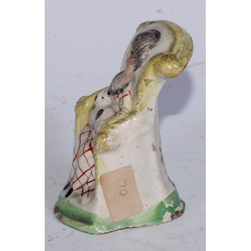 379 - A Prattware  figure, modelled as a lady wrapped in a shawl, sponged in tones of blue and brown, 7.5c... 