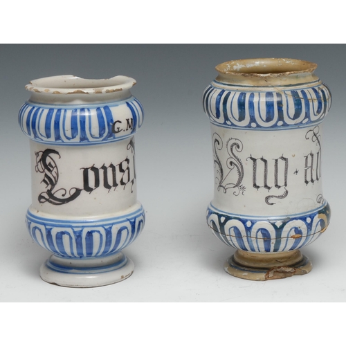 369 - A 17th century maiolica albarello pharmaceutical drug jar, painted in tones of blue with bands of fl... 