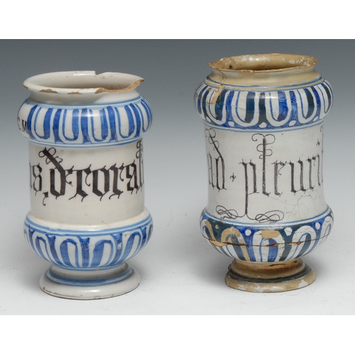 369 - A 17th century maiolica albarello pharmaceutical drug jar, painted in tones of blue with bands of fl... 