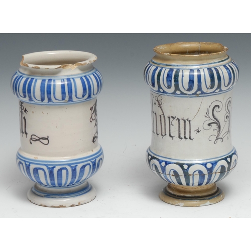 369 - A 17th century maiolica albarello pharmaceutical drug jar, painted in tones of blue with bands of fl... 