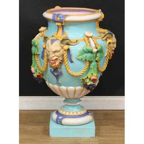 375 - A large Minton Majolica pedestal ovoid vase, in relief with garlands of of fruit and foliage, suspen... 