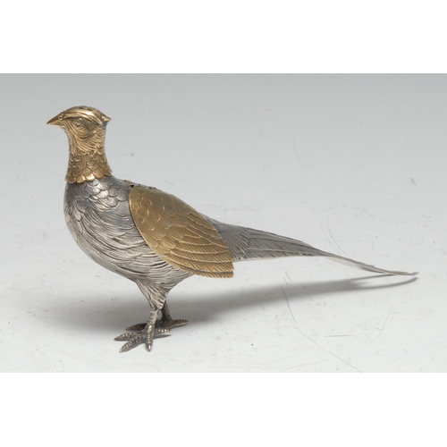 115 - A German silver and silver-gilt novelty pepper, as a pheasant, articulated wings, 19cm long, early 2... 