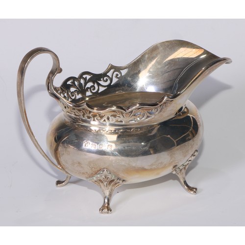 110 - A George V silver tea service, pierced rims, pad feet, Thomas Edward Atkins, Birmingham 1917, 1113g,... 