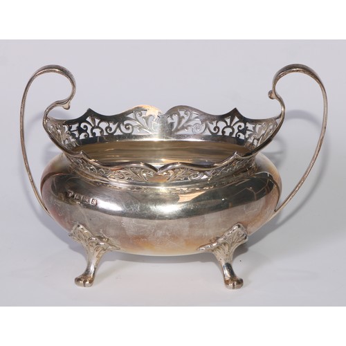 110 - A George V silver tea service, pierced rims, pad feet, Thomas Edward Atkins, Birmingham 1917, 1113g,... 