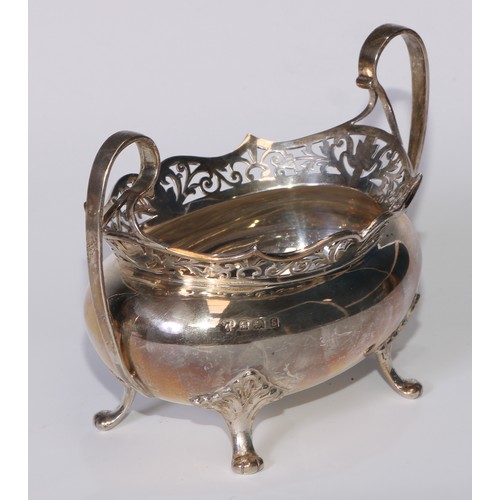 110 - A George V silver tea service, pierced rims, pad feet, Thomas Edward Atkins, Birmingham 1917, 1113g,... 