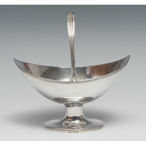 71 - A George III Provincial silver navette shaped pedestal sugar basket, swing handle, reeded borders, 1... 