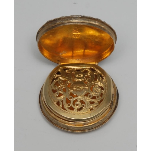 95 - A George III silver-gilt circular vinaigrette, hinged cover and base engine turned within a foliate ... 