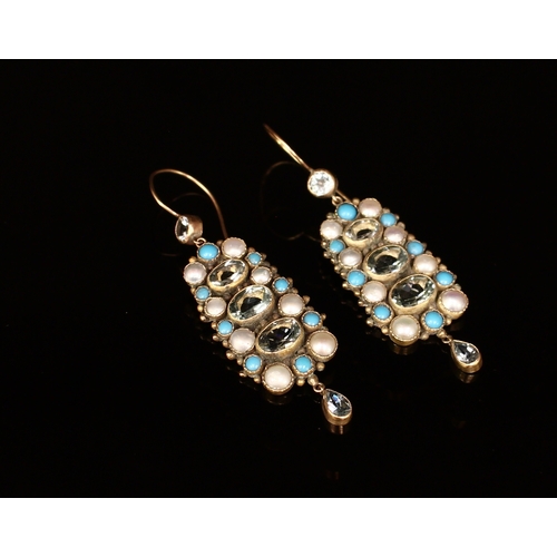 318 - A pair 9ct gold droplet earrings, each set with an arrangement of faceted aquamarine and polished tu... 