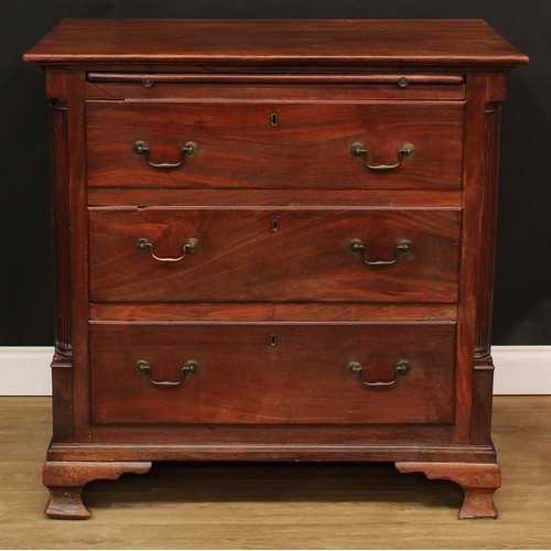 1803 - A George III mahogany bachelor's chest, oversailing rectangular top a slide and three long drawers, ... 