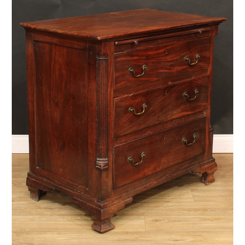 1803 - A George III mahogany bachelor's chest, oversailing rectangular top a slide and three long drawers, ... 