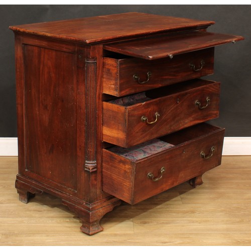 1803 - A George III mahogany bachelor's chest, oversailing rectangular top a slide and three long drawers, ... 