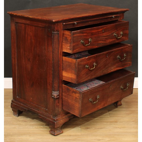 1803 - A George III mahogany bachelor's chest, oversailing rectangular top a slide and three long drawers, ... 