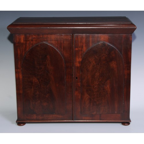 1804 - A William IV mahogany table cabinet, moulded rectangular top above a pair of rectangular doors with ... 