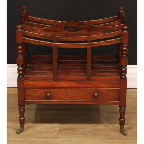 1807 - A Victorian mahogany four-section Canterbury, bowed divisions, pierced carry handle, turned supports... 